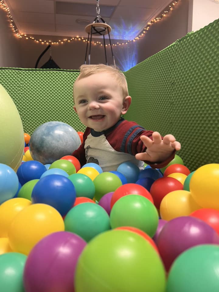 Baby in ball pit | Sprouts Therapy Center
